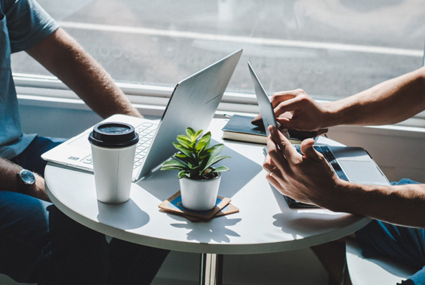 Adobe Campaign - two people working on laptops