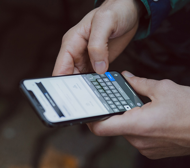 Grow brand engagement via community involvement by leveraging AEM - man reads messages on phone