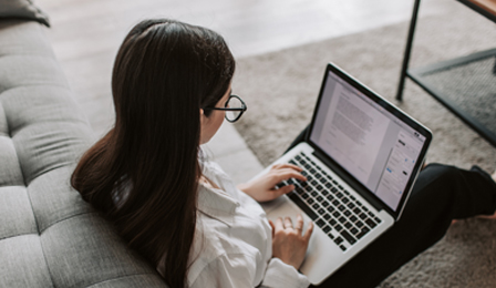 The Hidden Costs of Not Modernizing Your MarTech Stack image of woman working on laptop